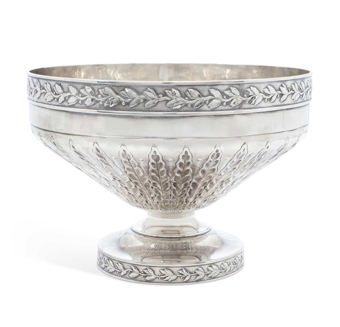 AN ARTS AND CRAFTS SILVER ROSE BOWL: by Martin, Hall & Co., Sheffield 1913, of circular form, chased with stylised leaf and berry decoration to borders, the bowl chased with repeating elongated leaves, on a stepped spreading circular foo