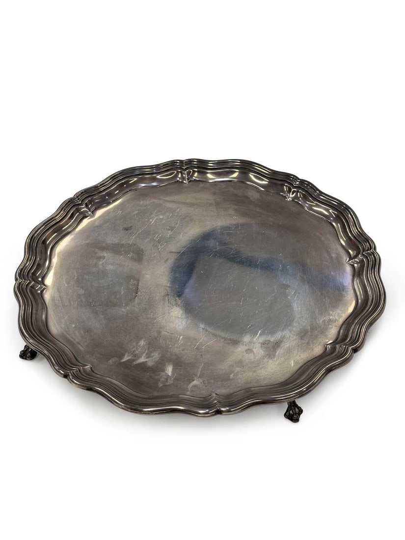 A GEORGE VI SILVER SALVER: by James Dixon & Son Ltd., Sheffield 1944, of circular form, with pie crust border, stamped 6904 14, raised on four ball and claw feet. 36cm diameter, 42.5 troy ounces