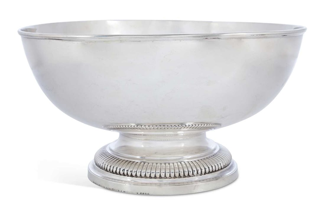 A VICTORIAN SILVER FOOTED BOWL: by John Hunt & Robert Roskell, London 1868, of plain circular form with a reeded rim, on a demi-fluted stepped foot, stamped to foot rim Hunt & Roskell, Late Storr & Mortimer, 4875. 28.75cm diameter, 