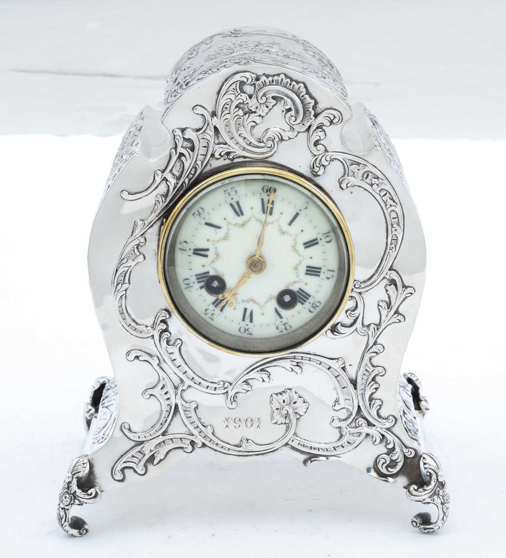 A LATE VICTORIAN SILVER MANTEL CLOCK (1 of 5)