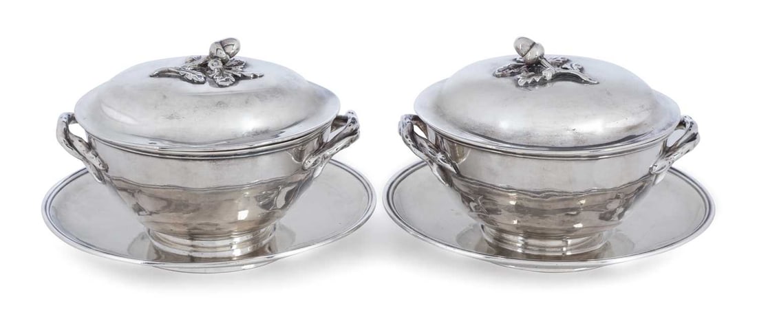 A PAIR OF GEORGE IV SILVER BUTTER DISHES ON STANDS: by Charles Fox II, London 1828, of compressed spherical form with foliate scroll handles, cast acorn and foliate final to cover, each with later drainer by FB Thomas & Co, 1902. (2) 10cm high, 19.7 tr