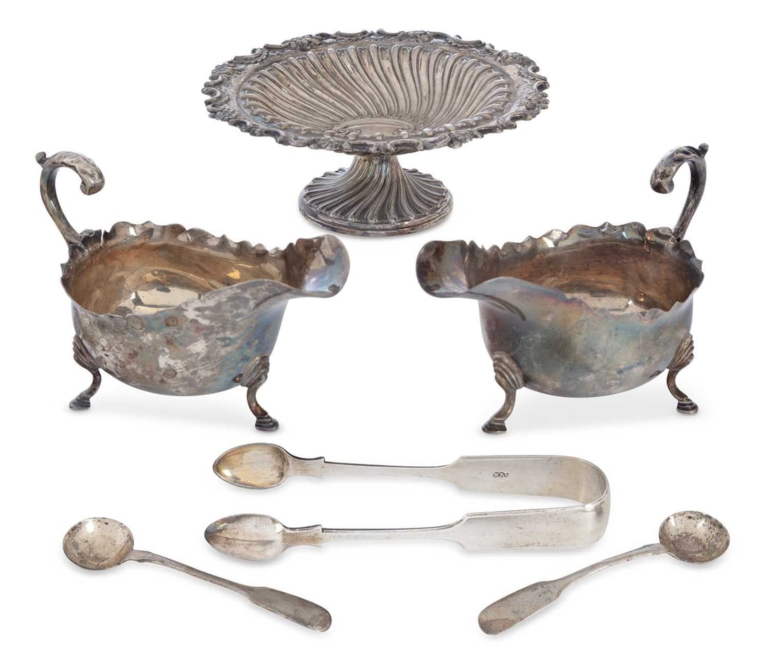 A GROUP OF VICTORIAN AND LATER SILVER: comprising a pair of George V sauce boats by Thomas Bradbury & Sons, Sheffield 1923, each of oval form with shaped outline, flying scroll handle with acanthus leaf thumbpiece, raised on three pad