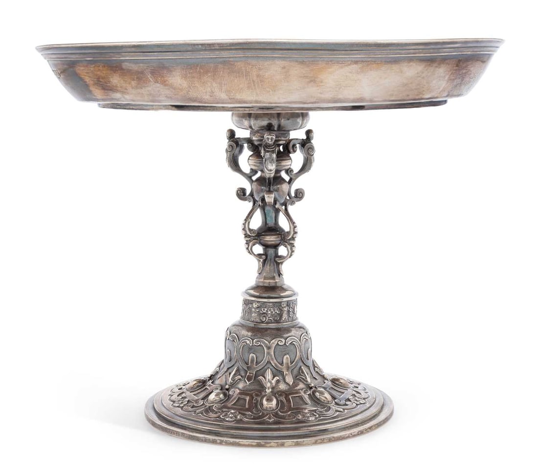 A VICTORIAN SILVER TAZZA: by George Fox, London 1872, the dished circular top with a domed base chased with strapwork and foliage, raised on a domed circular foot with similar decoration. 16.5cm high, 20cm diameter, 18.7 troy
