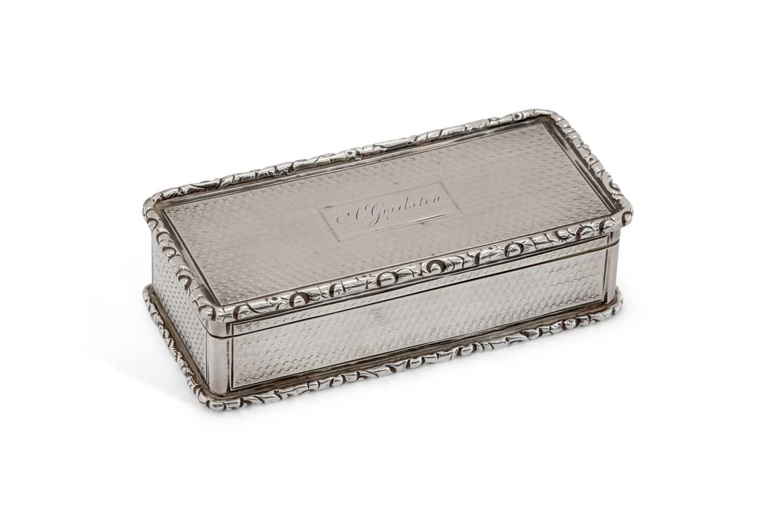A GEORGE IV SILVER SNUFF BOX: by Ledsam, Vale & Wheeler, Birmingham 1828, rectangular form with hinged cover and scroll cast rim, the cartouche engraved A. Goulston, gilded to interior. 8cm by 3.6cm by 2.2cm, 2.8 troy ounces Good 