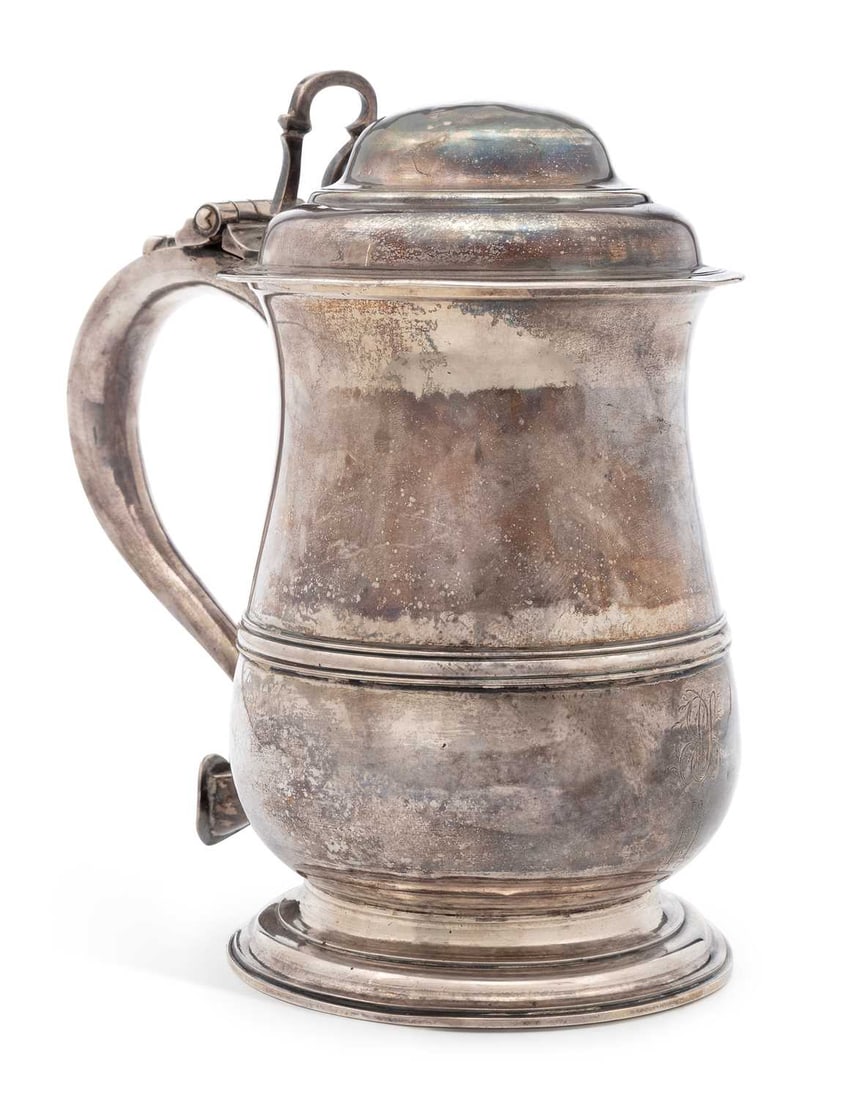 A GEORGE III SILVER TANKARD: by Thomas Whipman & Charles Wright, London 1762, of baluster form with monogrammed presentation engraving, the domed hinged cover with open thumb piece, the scroll handle engraved CW to heart terminal