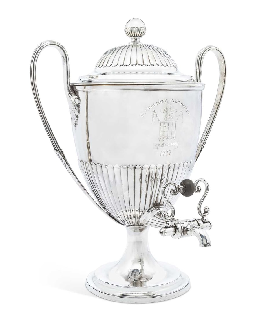 A LARGE GEORGE III SILVER PRESENTATION TWO-HANDLED WATER URN OR SAMOVAR: by William Stroud, London 1805, engraved for Westminster Fire Office, of circular form with a stepped fitted cover, demi-fluted with ball finial, with twin reeded handles decorated with leaves, comple