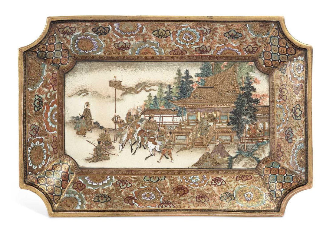 A JAPANESE SATSUMA TRAY MEIJI PERIOD: of rectangular form with canted corners and an everted rim, finely painted and gilt with a procession of mounted samurai and attendants before a temple, a standard bearer and seated courtiers beyond,