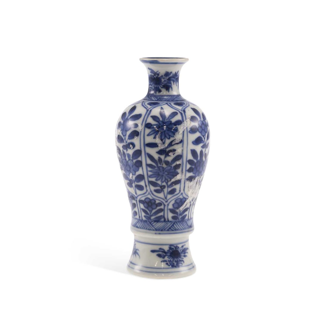 A CHINESE PORCELAIN VASE KANGXI PERIOD: baluster form, painted with lappet panels of flowering plants, the base with a square seal mark. 13cm high In good condition, no visible cracks or repairs