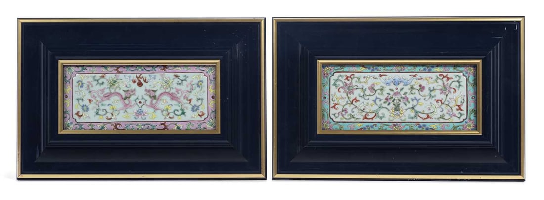A PAIR OF CHINESE FAMILLE ROSE PLAQUES QING DYNASTY: the first plaque painted with dragons contesting the flaming pearl, amongst stylised floral scroll, the second with bat and peaches, amongst lotus scroll, both with modern frames. (2) Both 39cm by 25.