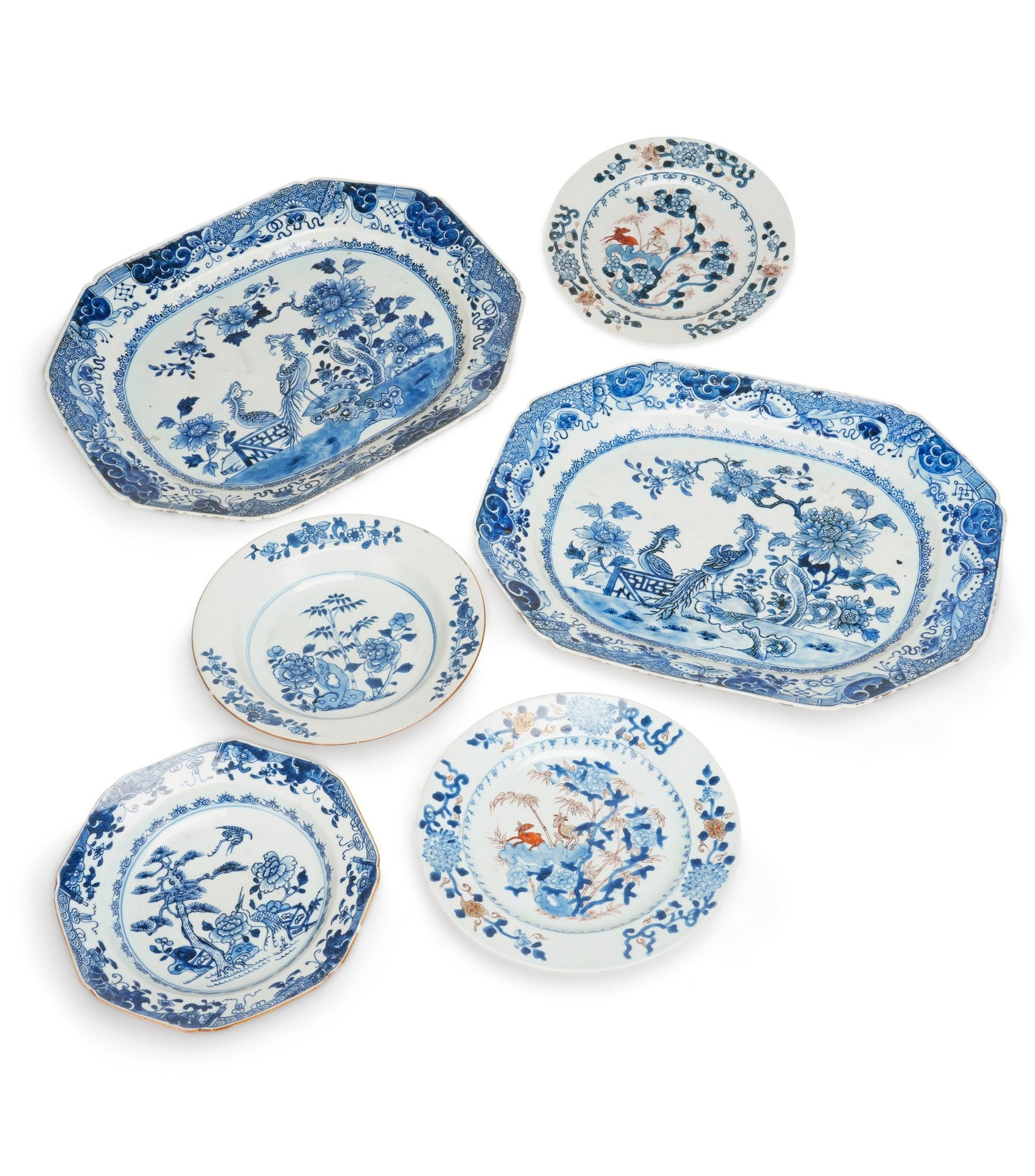A GROUP OF CHINESE EXPORT PORCELAIN 18TH CENTURY: comprising a pair of Chinese Imari plates, painted with two deer beside rockwork among bamboo and peony; a blue and white plate painted with peony and bamboo issuing from rockwork; an octagonal blue a