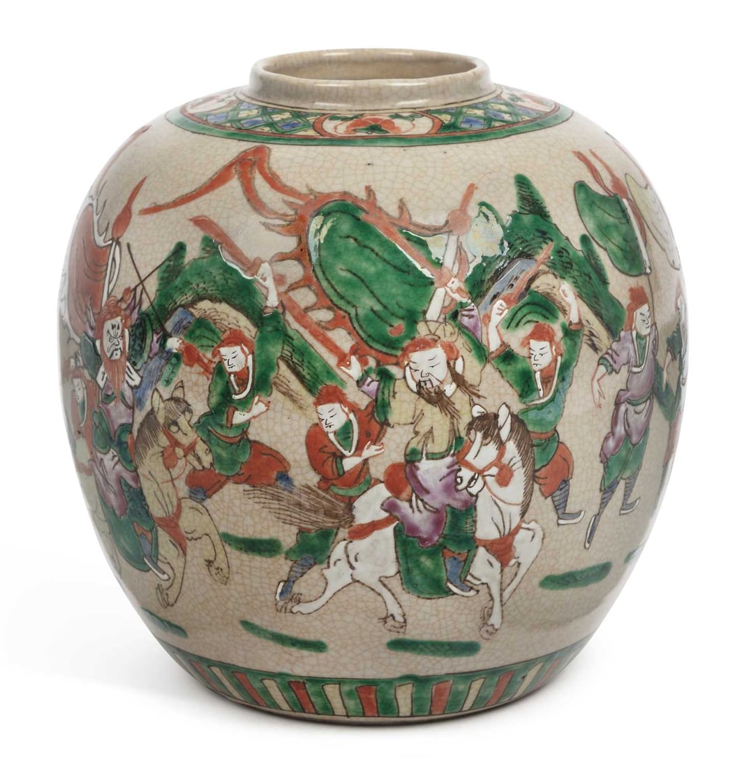 A CHINESE FAMILLE VERTE CRACKLE-GLAZED JAR: of ovoid form, painted with warriors on horseback in a battle scene, within patterned borders, bearing an apocryphal four-character Chenghua mark. 20cm high No visible damage or repair