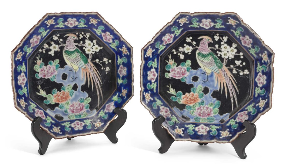 A PAIR OF JAPANESE PORCELAIN PLAQUES CIRCA 1900: both octagonal form, painted in enamels with pheasants perched upon rocks, amongst flowering plants, the borders with stylised flowerheads. 28.5cm wide