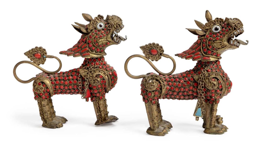 A PAIR OF ASIAN GILT-METAL FO DOGS 20TH CENTURY: both with detachable heads, and enamel decoration, possibly Thai. 11.5cm high