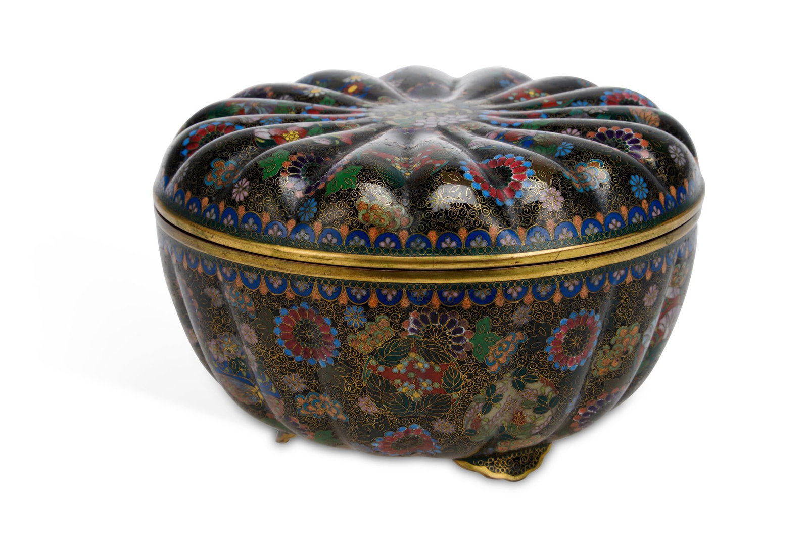 A JAPANESE CLOISONNE BOX AND COVER MEIJI PERIOD: of lobed melon form, worked in coloured enamels and gilt-wire with chrysanthemum, cherry blossom, maple and other flowers on a black ground within a dense scrolling gold wire ground, the shoulders wit