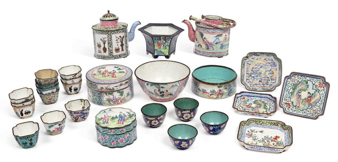 A GROUP OF CHINESE CANTON ENAMEL WARES QING DYNASTY: comprising of two 18th Century enamelled teapots; a tiered box and cover; a small blue ground jardiniere with silver inlay; an 18th Century tea bowl and stand with dragon decoration; a tea bowl and st