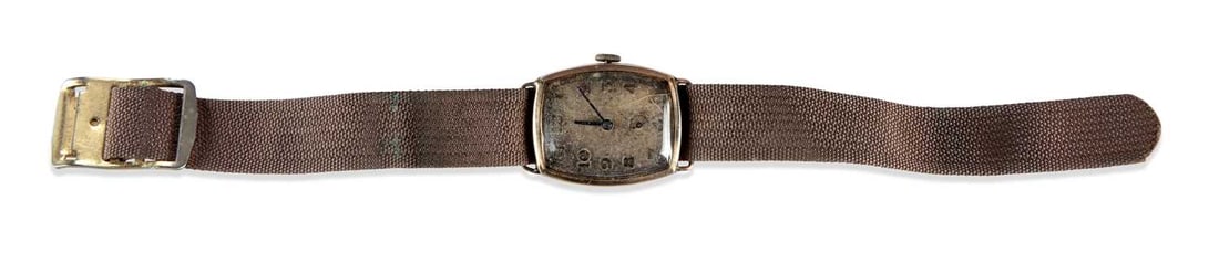 A LADY'S 9CT GOLD ROTARY STRAP WATCH: the silvered tonneau dial with gilt Arabic numerals and sub-seconds dial at the 6 o'clock position, blued steel hands, tonneau case with hinged back and wire lugs, internally hallmarked 9ct gold, Glas