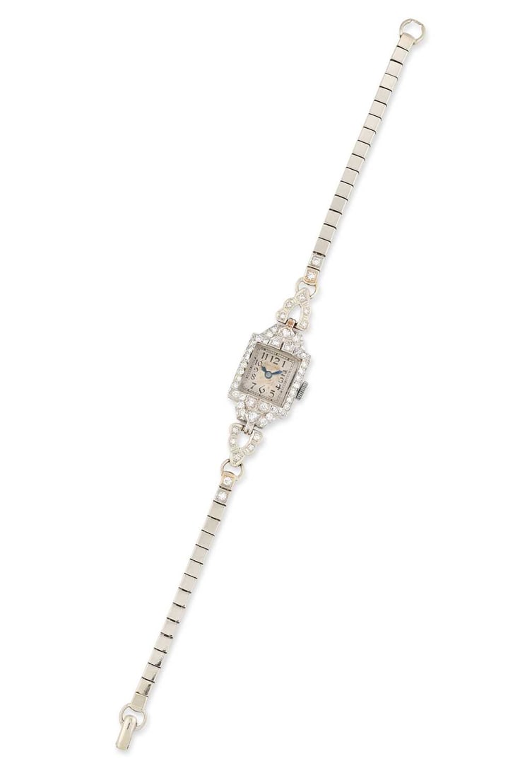 A LADY'S PLATINUM AND DIAMOND HAMILTON BRACELET WATCH: the square silvered dial signed Hamilton, with Arabic indices and outer minute track, blued steel hands, square-case with decorated lugs set with forty-eight eight-cut diamonds, fitted with a square l