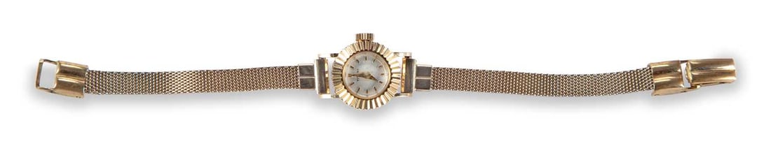A LADY'S 18K GOLD TITONI WATCH: the silvered circular dial signed Titoni, with gilt baton indices and sword hands, fluted bezel and case sides, plain crown, push-on case back, manually wound movement signed Beuche Girod 64 17 Jewels