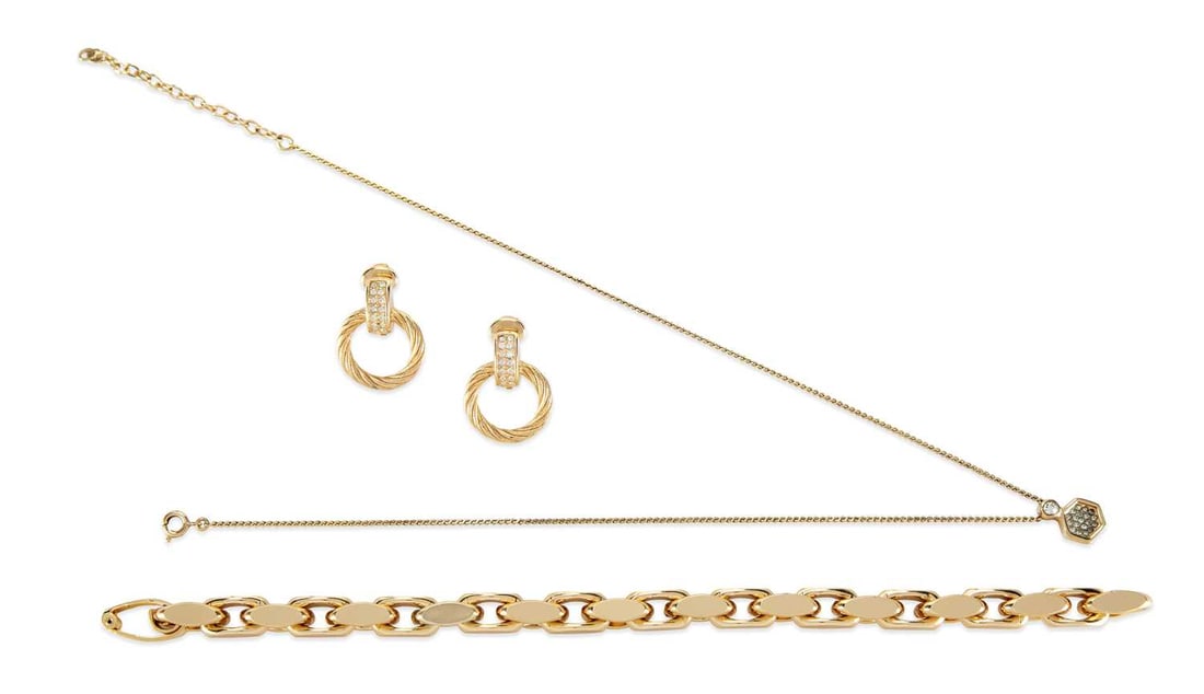 A GROUP OF DESIGNER JEWELLERY: comprising a Christian Dior gold-tone paste-set pendant on chain, a pair of paste set clip earrings and a chain bracelet; a Gucci silver heart toggle bracelet, hallmarked, with box and pouch; and an H
