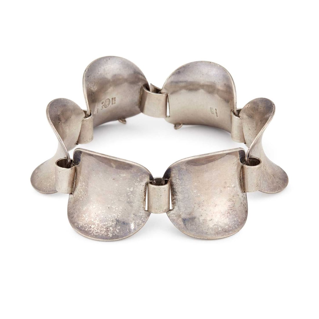 STEFFEN ANDERSEN FOR GEORG JENSEN, A DANISH SILVER BRACELET: model 210, formed of curved links, stamped '925S', import hallmarked London 1972, 20cm long, 54 grams Light surface scratching