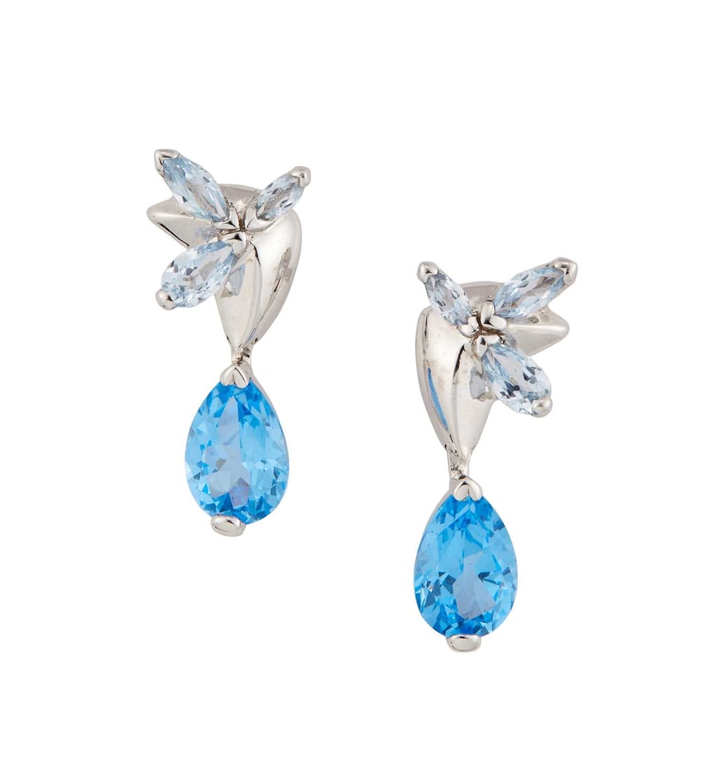 A PAIR OF BLUE TOPAZ PENDANT EARRINGS: pear-cut blue topaz suspended from pale blue topaz-set mounts, with post fittings, unmarked. 2.2cm long, 3.6 grams Good condition