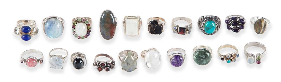 A COLLECTION OF SILVER GEM-SET RINGS: including moonstone, moss agate and a reverse intaglio. (20) Ring sizes S1/2 and smaller, 155 grams gross One cluster ring with an outer stone missing