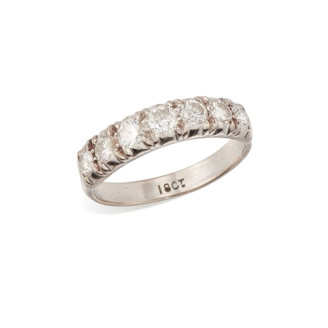A DIAMOND HALF HOOP RING: seven round brilliant-cut diamonds in claw settings, stamped '18CT'. Estimated total diamond weight 0.70 carat, ring size Q, 4.2 grams Good condition. Estimated diamond colour: H/I, estimated diamond