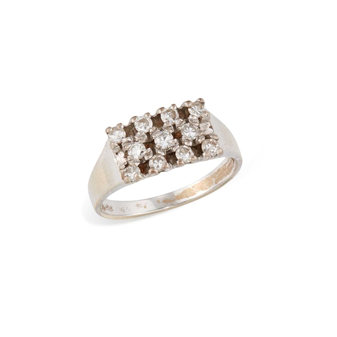 A DIAMOND RING: three off-set rows of round-cut diamonds, stamped '18K'. Estimated total diamond weight 0.55 carat, ring size N, 3.4 grams Good condition. Estimated diamond colour: G/H, estimated diamond clarity: