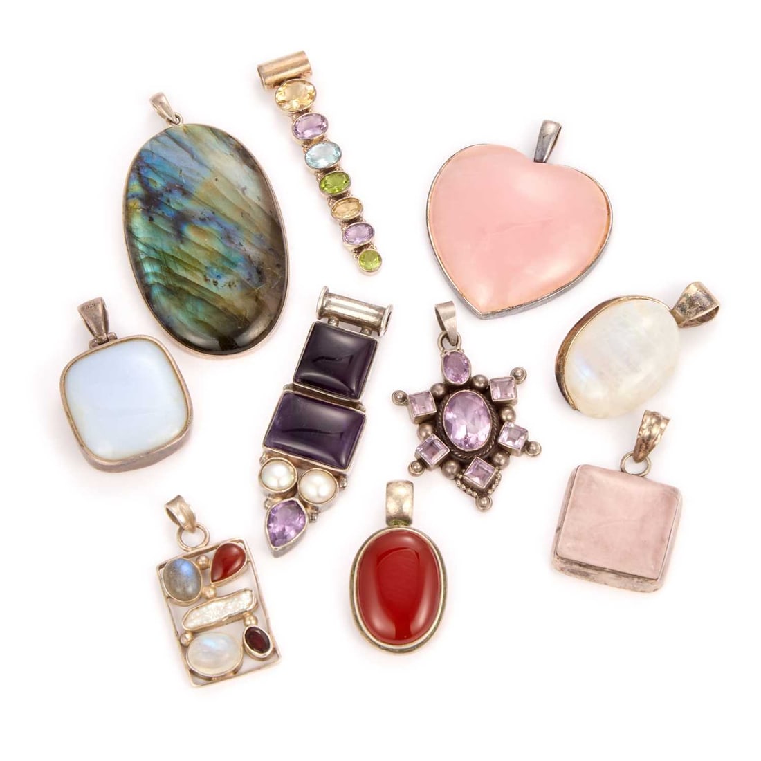 A COLLECTION OF SILVER GEMSTONE PENDANTS: including labradorite and rose quartz. (10) 7cm long and smaller, 172 grams gross Good condition