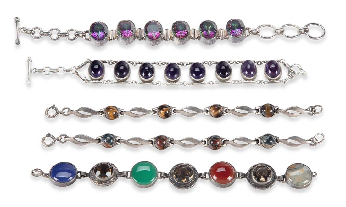 FIVE SILVER GEM-SET BRACELETS: including mystic topaz, tigers eye, moss agate, etc. (5) 20.5cm long, 129 grams gross Good condition