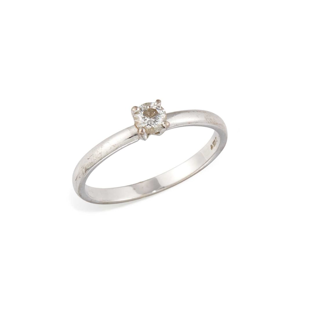 AN 18 CARAT WHITE GOLD SOLITAIRE DIAMOND RING: a round brilliant-cut diamond in a claw setting, hallmarked Sheffield. Estimated diamond weight 0.25 carat, ring size P, 2.4 grams Good condition. Estimated diamond colour: H/I, estimated diamond