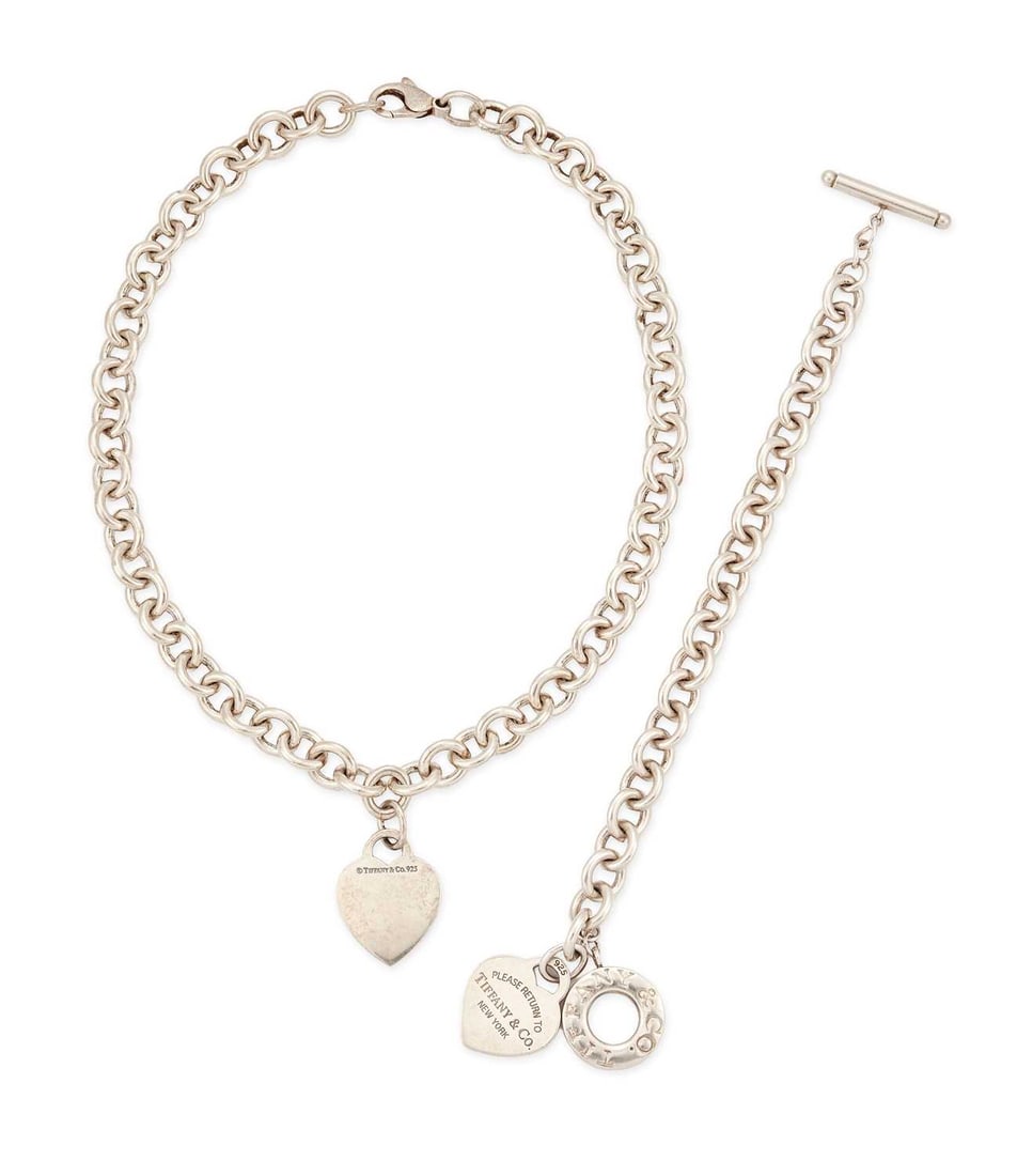 TIFFANY & CO, A SILVER HEART TAG NECKLACE AND BRACELET: the necklace with a plain heart tag on a curb link chain, stamped '925'; the bracelet with a 'Return to Tiffany' heart tag and toggle clasp, hallmarked. (2) Necklace 39cm long, bracelet 17cm long,