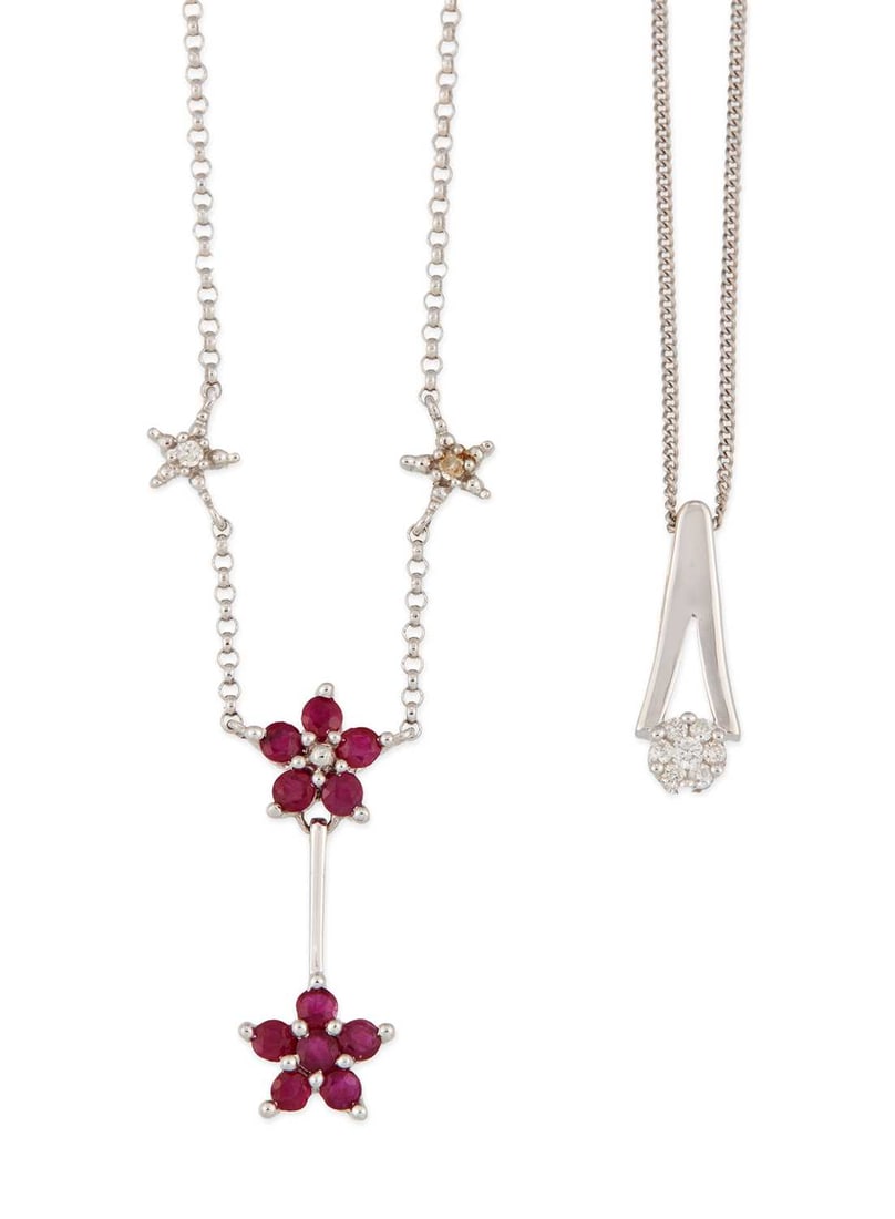TWO 9 CARAT WHITE GOLD GEM-SET PENDANT NECKLACES: comprising a diamond cluster pendant, hallmarked, on a fine chain; and a ruby and diamond cluster pendant, stamped '9K', on a fine chain. (2) Pendants 2cm long and smaller, 4.3 grams gross Good