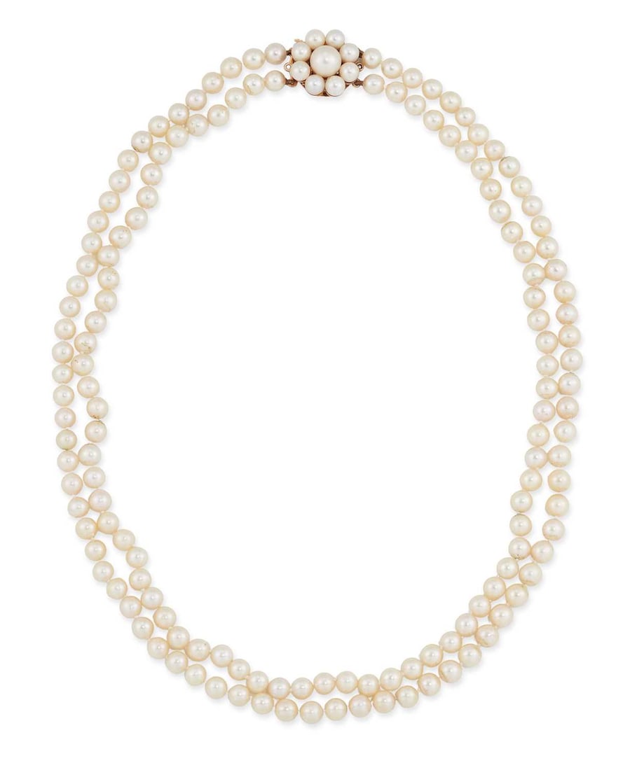 A 9 CARAT GOLD CULTURED PEARL NECKLACE: two strands of uniform cultured pearls knotted to a pearl cluster clasp, hallmarked London 1984. 47cm long, pearls 5.5-6mm, 46 grams Slightly uneven texture to some pearls
