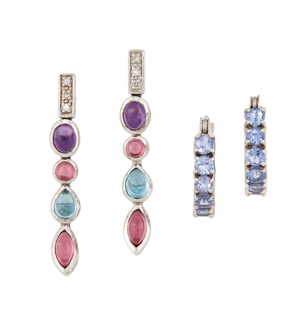 TWO PAIRS OF 9 CARAT WHITE GOLD GEM-SET EARRINGS: comprising a pair of blue and pink topaz, amethyst and diamond pendant earrings, hallmarked; and a pair of tanzanite hoop earrings, with post fittings, hallmarked. (2) 2.5cm long and smaller, 4 grams