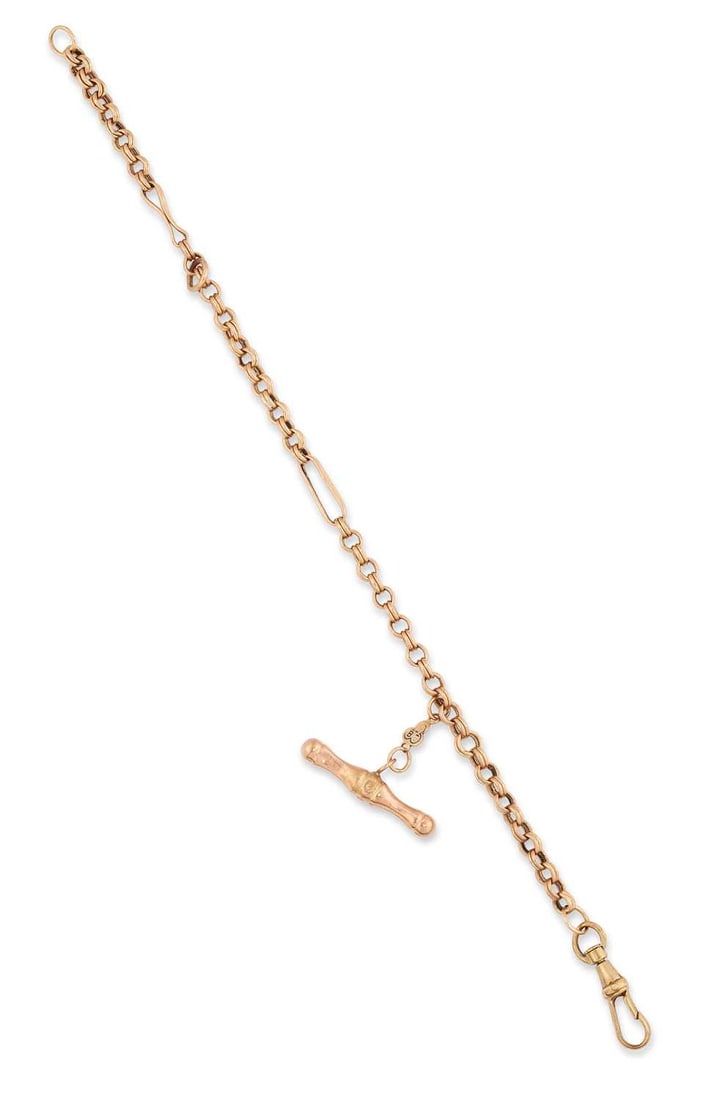 A 9 CARAT GOLD BRACELET: double curb links, spaced by long bar links, with a T-bar and clip, hallmarked. 20.5cm long, 5.5 grams One long link misshapen, some wear to the t-bar
