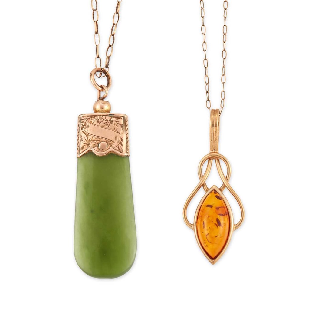 TWO GEM-SET PENDANT NECKLACES: comprising a nephrite pendant with a foliate engraved mount, unmarked, on a fine chain; and a 9 carat gold amber pendant, hallmarked, on a fine chain. (2) Pendants 4cm long and smaller, 5.6 grams