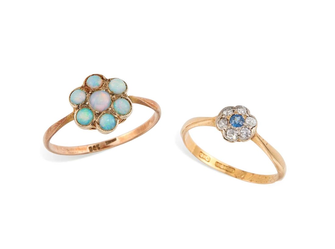 TWO GEM-SET RINGS: comprising a sapphire and diamond cluster ring, stamped '18CT'; and an opal cluster ring, stamped '9CT'. (2) Ring size K and O, 1.4 grams gross Sapphire and diamond cluster ring: band worn to a