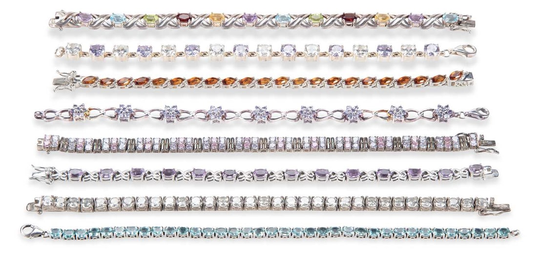 A GROUP OF SILVER GEM-SET BRACELETS: including cubic zirconia, garnet, tanzanite, etc. (8) 20cm long and smaller, 128 grams gross Good condition