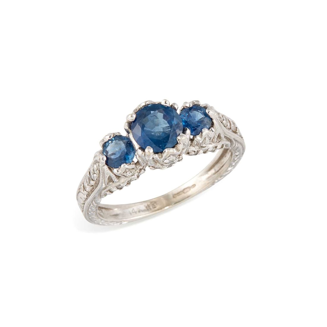 A 14 CARAT WHITE GOLD SAPPHIRE AND DIAMOND RING: three graduated round-cut sapphires to a fancy diamond-set band, hallmarked Birmingham. Ring size M, 4.1 grams Good condition.