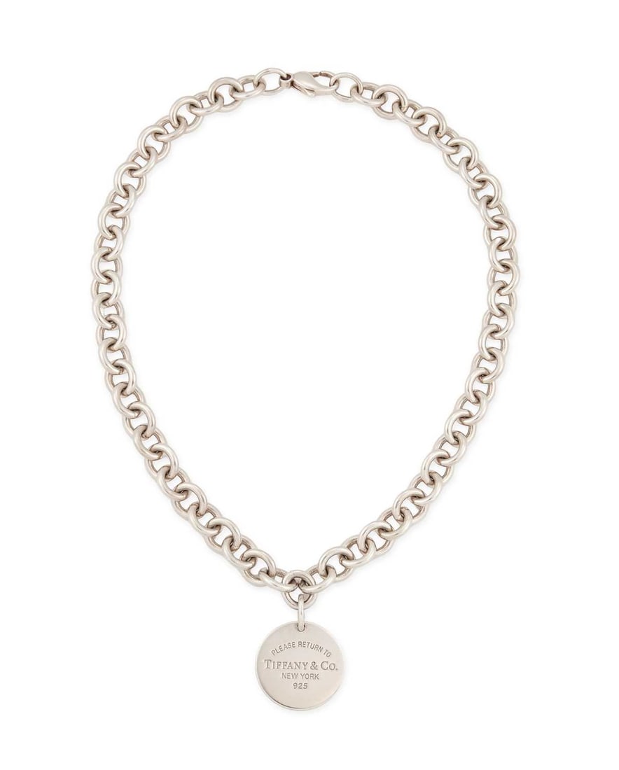 TIFFANY & CO, A SILVER 'RETURN TO TIFFANY' PENDANT NECKLACE: an engraved circular tag to a curb link chain necklace, hallmarked, with box. 39cm long, 71 grams Good condition
