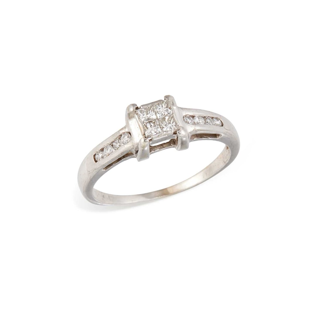 AN 18 CARAT WHITE GOLD DIAMOND CLUSTER RING: four princess-cut diamonds in a square setting, to diamond-set shoulders, hallmarked London. Estimated total diamond weight 0.40 carat, ring size O, 3.1 grams Shank a little thin. Estimated diamond