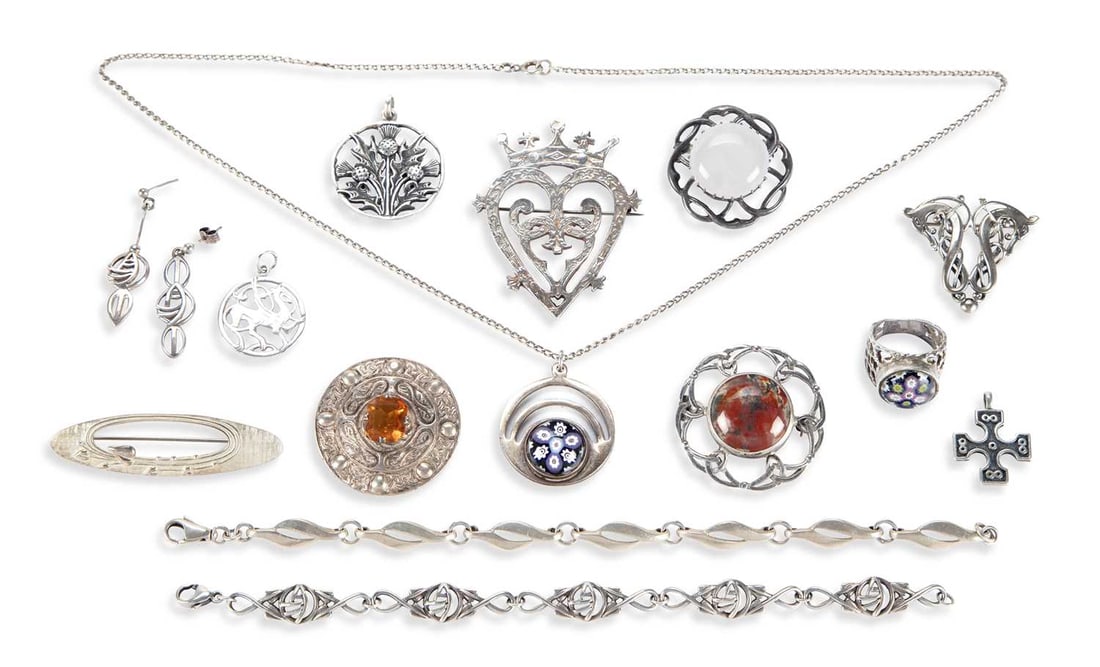 A COLLECTION OF SILVER CELTIC JEWELLERY: including a Robert Allison Luckenbooth brooch; a Caithness glass pendant on chain; Ola Gorie brooches; a Rennie Mackintosh style bracelet and earring set; Iona; etc. (14) Brooches 5.4cm long and