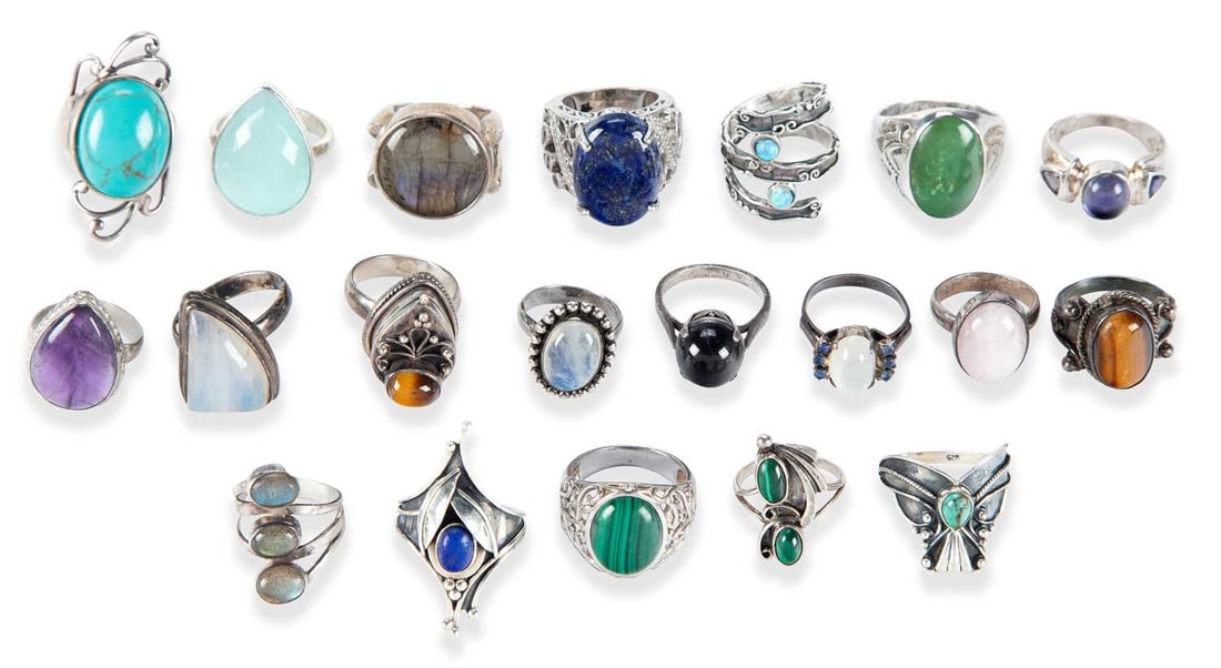A COLLECTION OF SILVER GEM-SET RINGS: including a tiger's eye poison ring; lapis lazuli; moonstone; labradorite; etc. (20) Ring size W and smaller, 150 grams gross Good condition