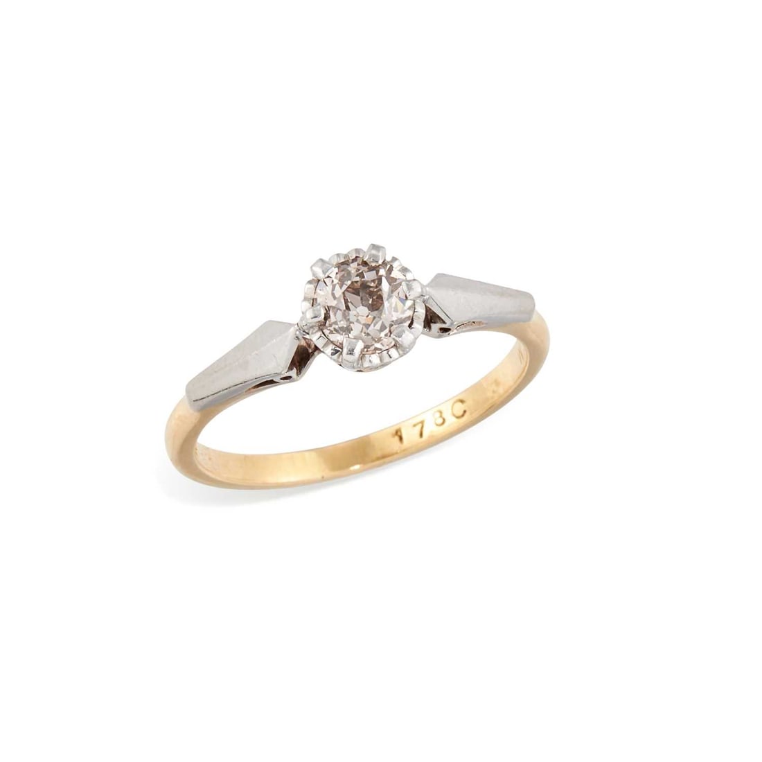 A SOLITAIRE DIAMOND RING: an old-cut diamond in an illusion setting, to angular shoulders, stamped '18CT'. Estimated diamond weight 0.45 carat, ring size N, 3 grams Good condition. Estimated diamond colour: I/J, estimated