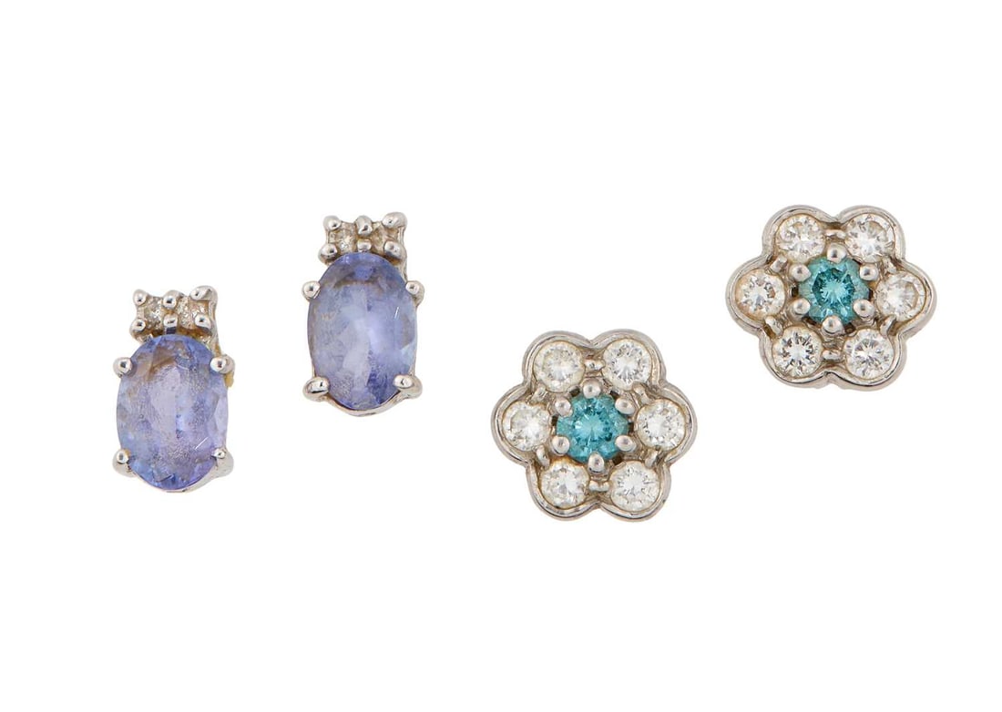 TWO PAIRS OF GEM-SET STUD EARRINGS: comprising a pair of 18 carat white gold blue and white diamond cluster stud earrings, hallmarked; and a pair of tanzanite and diamond stud earrings, unmarked. (2) First total estimated diamond