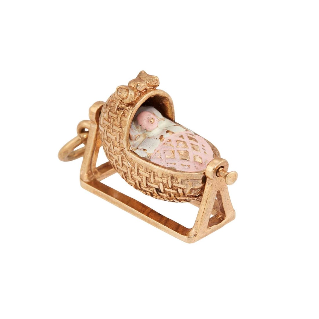 A 9 CARAT GOLD PINK ENAMEL CRADLE PENDANT CHARM: hallmarked. 2cm long, 3.9 grams Rubbing and loss to the enamel
