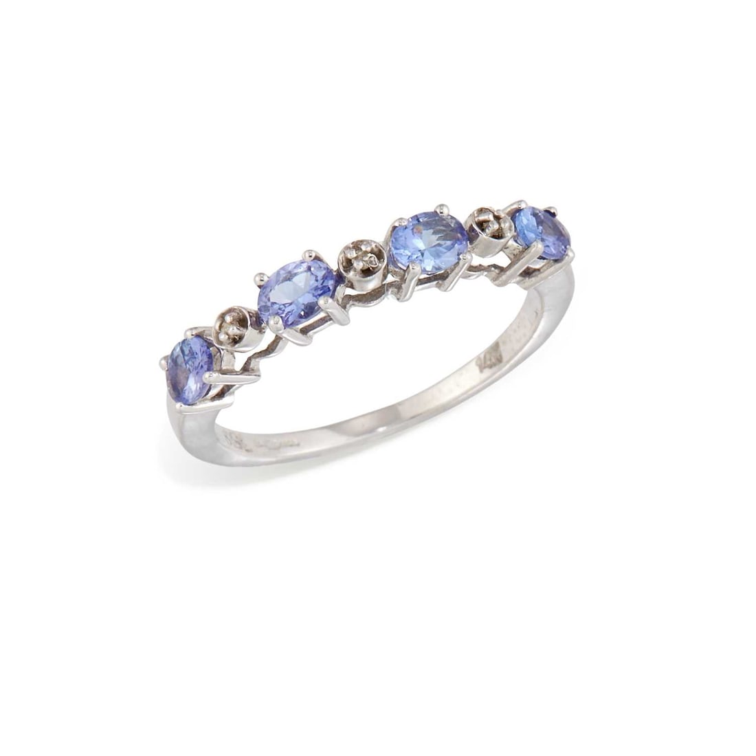 A 14 CARAT WHITE GOLD TANZANITE AND DIAMOND HALF HOOP RING: oval-cut tanzanite spaced by diamond accents, hallmarked Birmingham. Ring size N, 2.2 grams Good condition