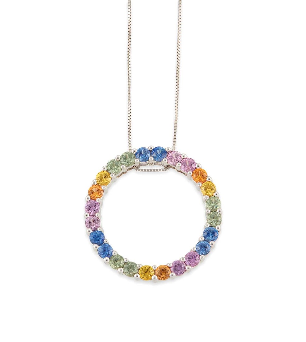 A 9 CARAT WHITE GOLD VARI-COLOURED SAPPHIRE PENDANT ON CHAIN: a hoop set with round-cut vari-coloured sapphires, to a fine chain, hallmarked. Pendant 2.7cm diameter, 6.4 grams Good condition