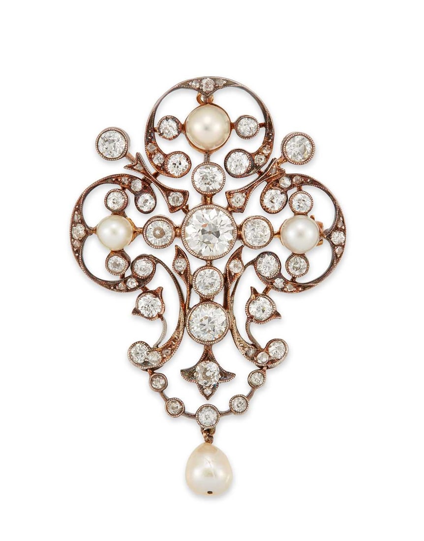 A BELL EPOQUE DIAMOND AND PEARL PENDANT BROOCH: old-cut diamonds and pearls within an open work scroll frame, with a pearl and diamond swag drop, unmarked. Estimated total diamond weight 6.70 carat, 5.8cm by 3.8cm, 13.2 grams Good condition. Clasp